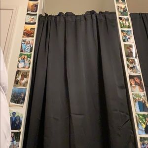 Black curtain with ruffles at top